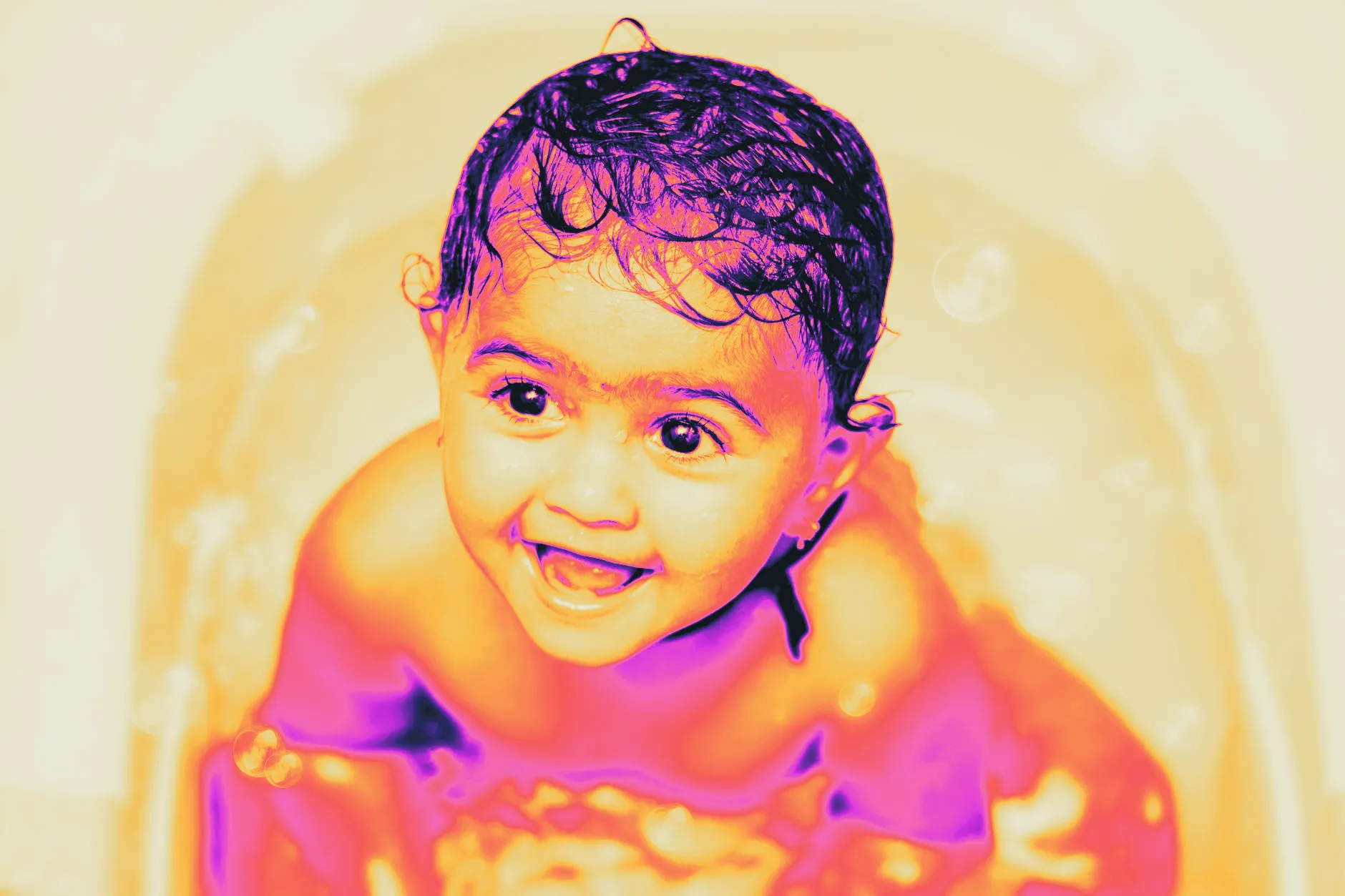 Water droplets during a baby's bath time, captured close up