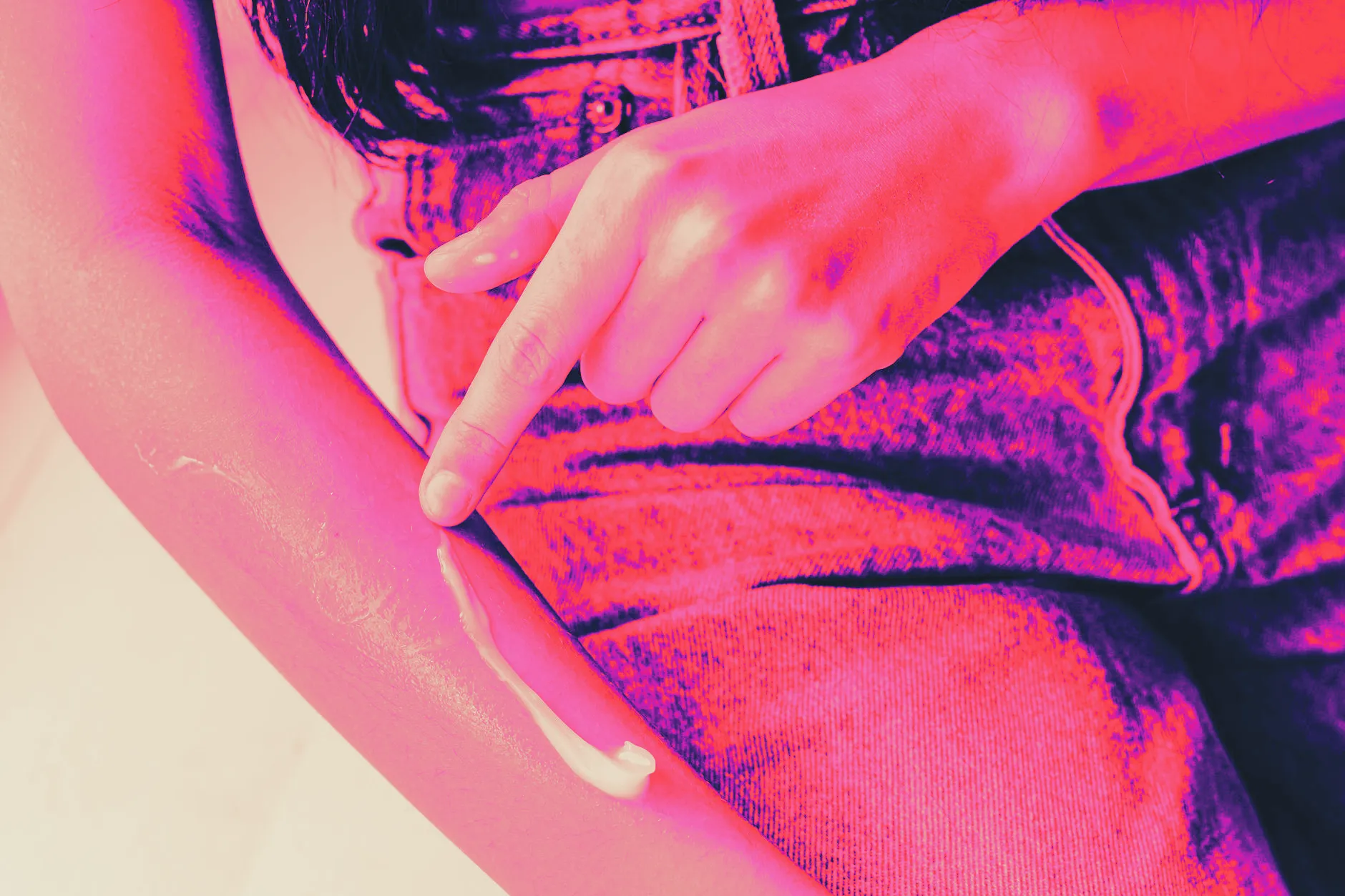 Lotion being applied to an arm, close up