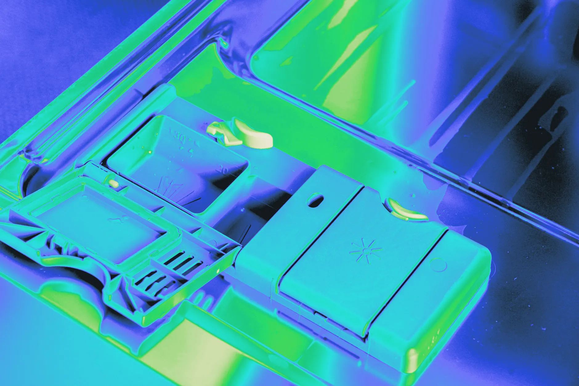 A detergent pod being placed into a dishwasher
