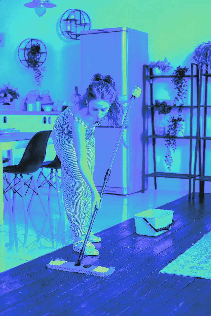 A mop gliding across a wood floor with light reflection