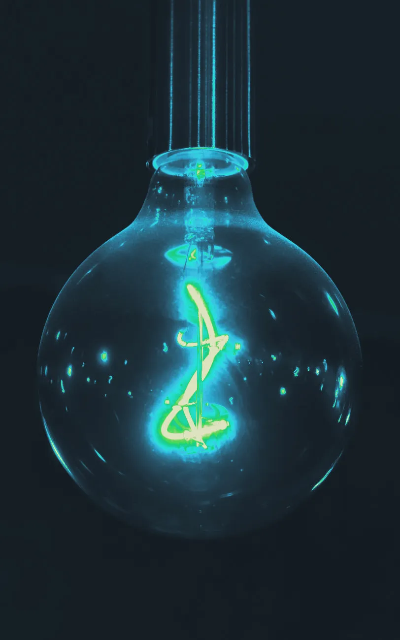 A lightbulb glowing warmly, shown close up