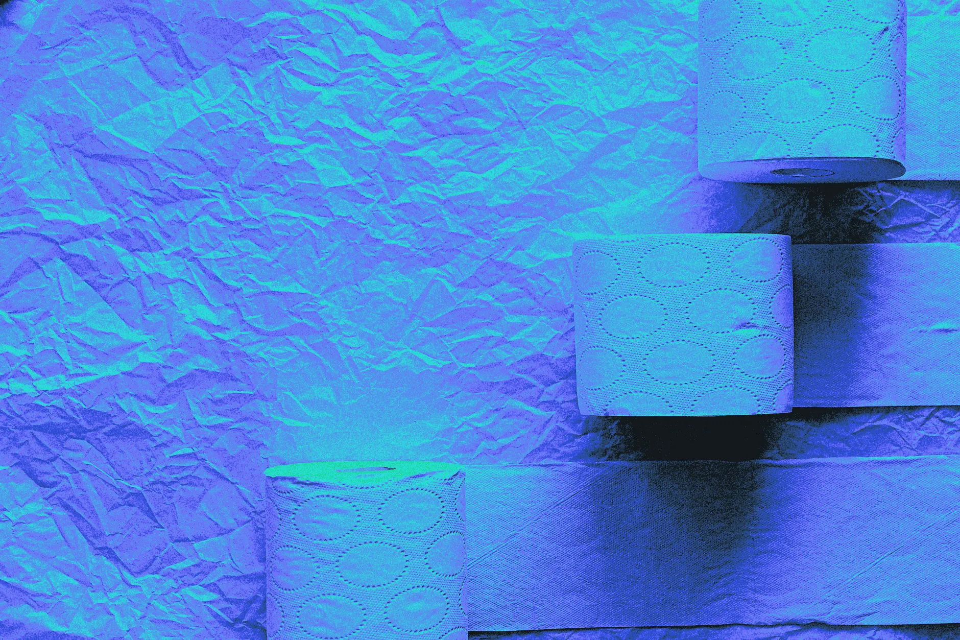 A roll of paper towels with one sheet torn, shown up close