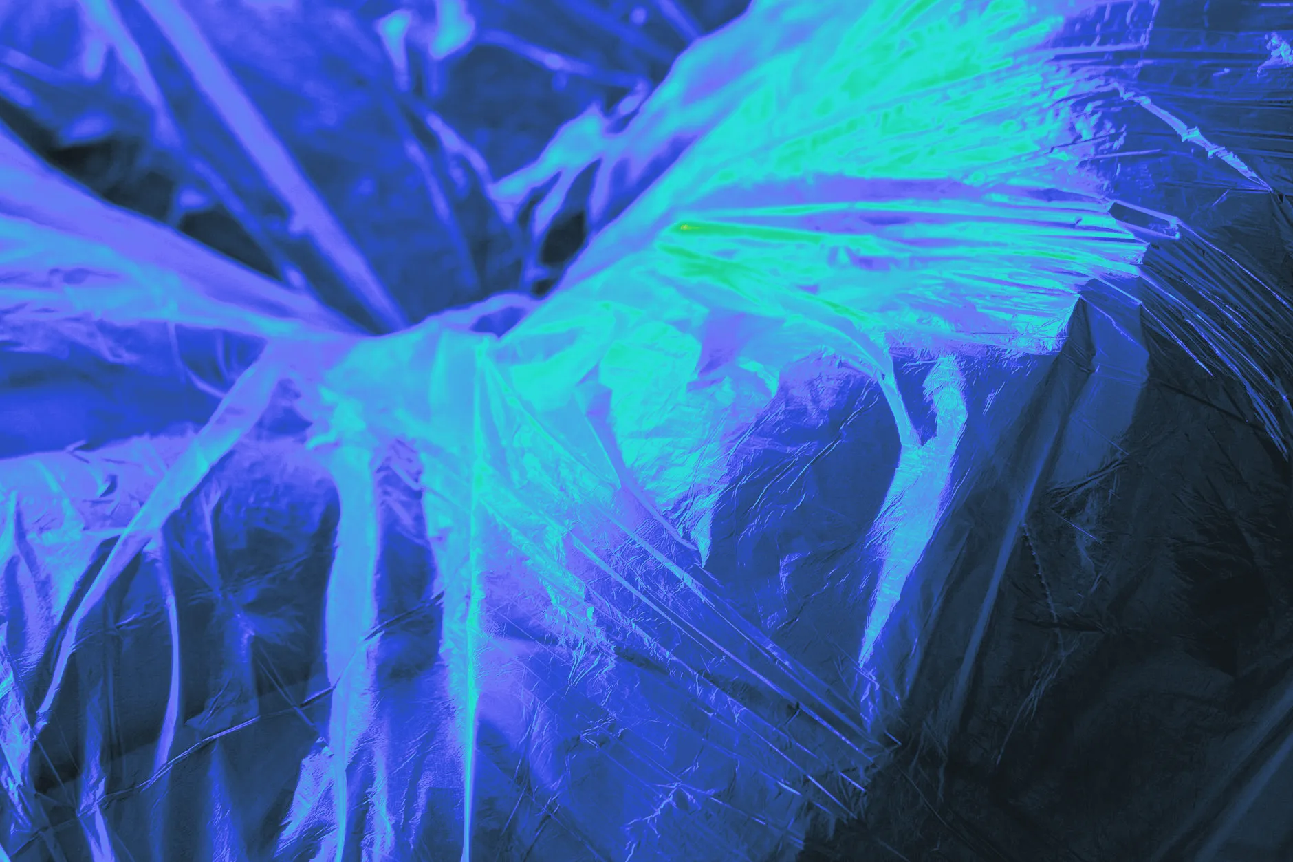 Plastic wrap stretched over a bowl, close up